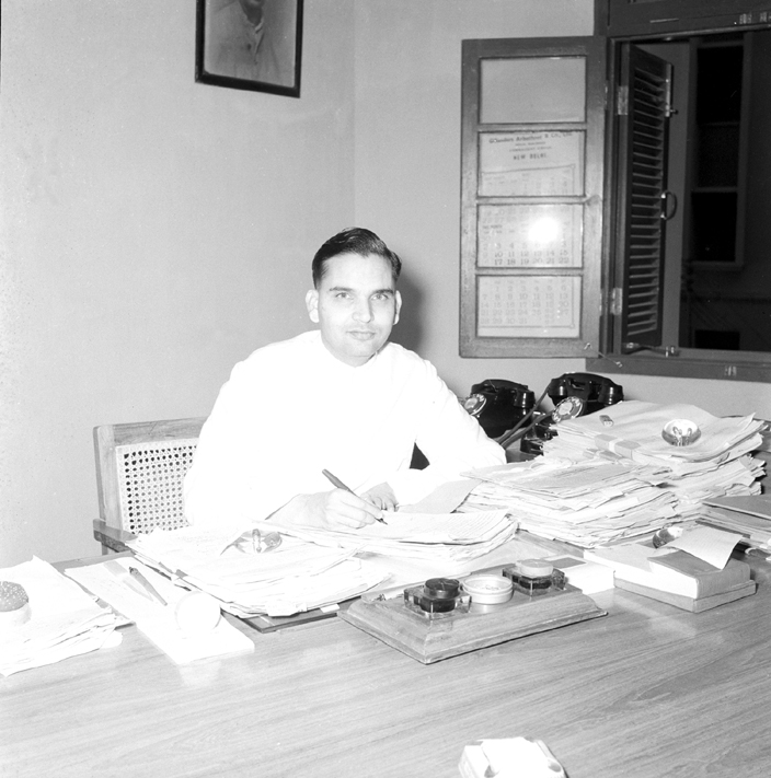 Manubhai working at his desk in 1952